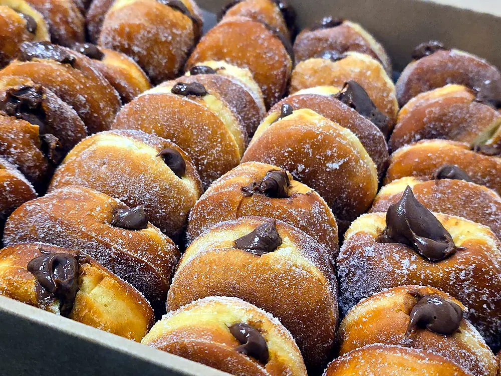 Boston cream style filled donuts dusted with sugar